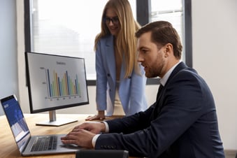 business-person-looking-finance-graphs (1)